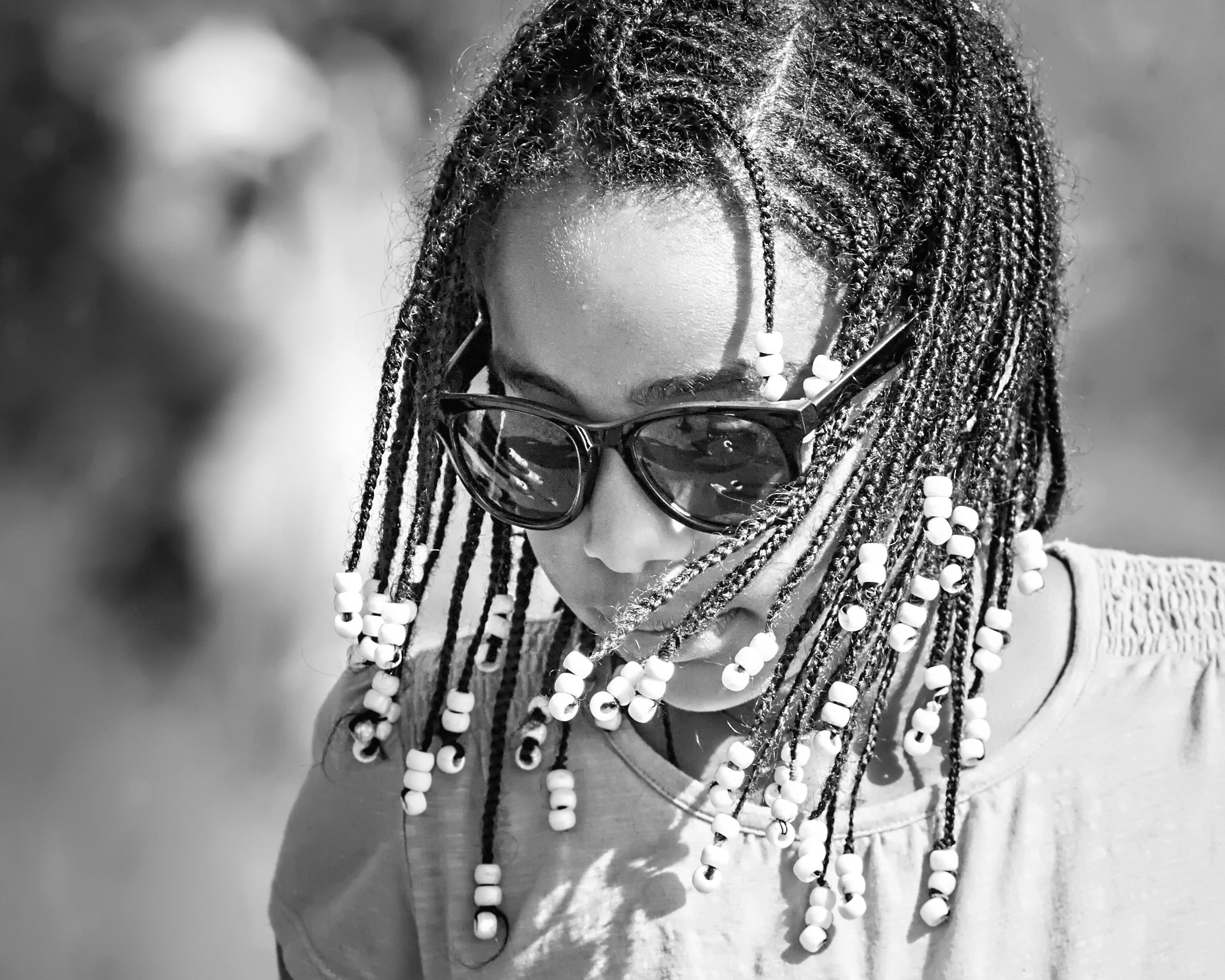 Editorial Afro-textured hair styling and intricate crown braids at Eva's Hair